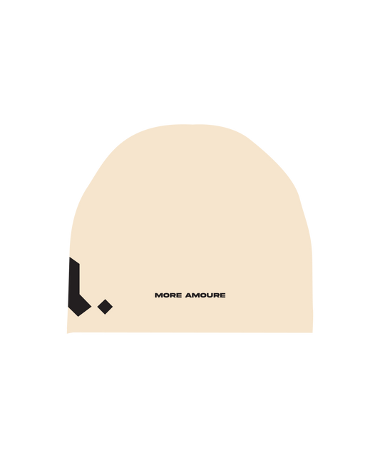 The back of the cotton skullcap in cream and black with embroidery of the words more amoure.